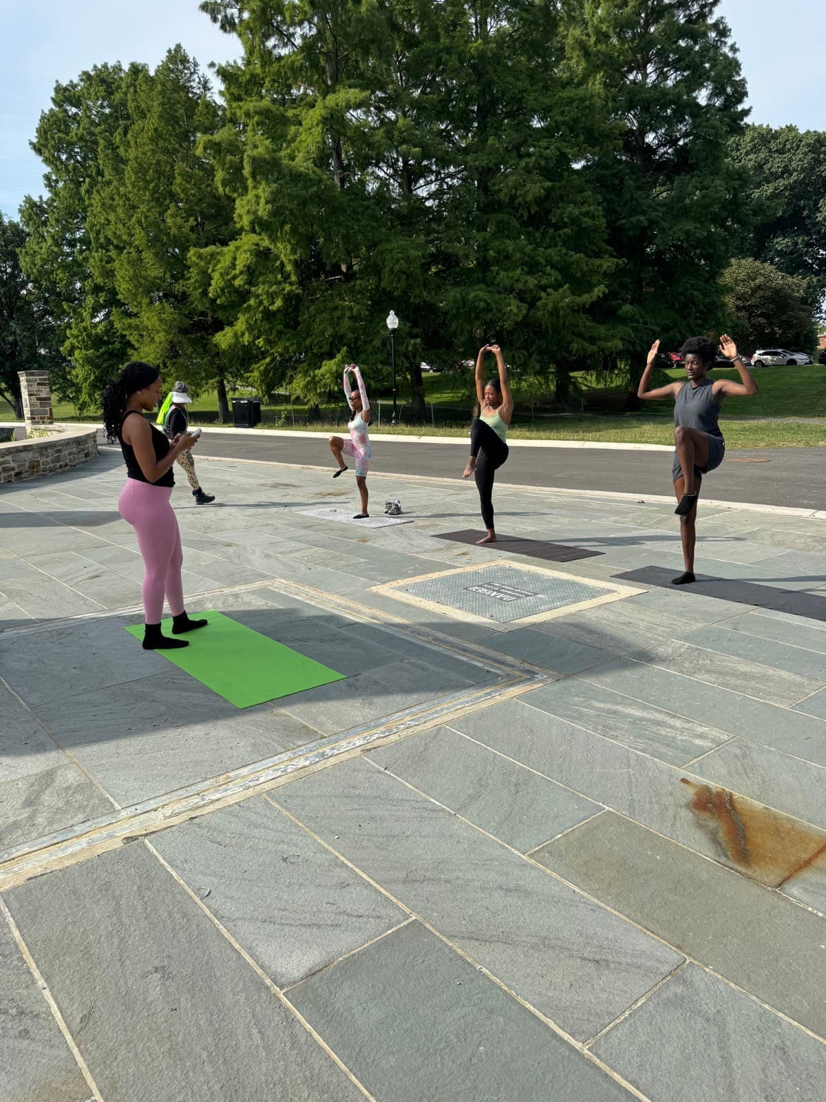 Aamirah leading a balance drill at the outdoor FitCamp